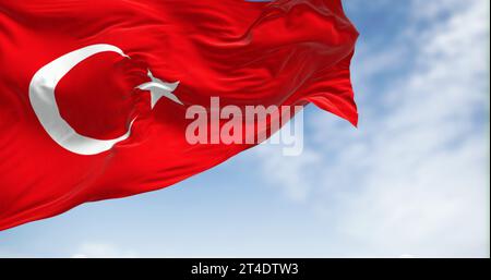 Turkish national flag waving in the wind on a clear day. Red flag with white crescent and a star. 3D illustration render. Fluttering fabric Stock Photo