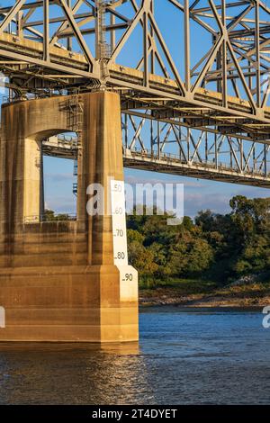 Low water in the Mississippi river exposes river bank by riverwalk in
