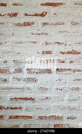 Front View of Weathered Painted Brick Wall Stock Photo