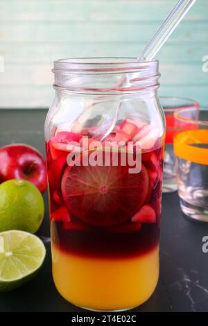 Homemade Red Wine Sangria in a Grass Bottle before Mixing Stock Photo