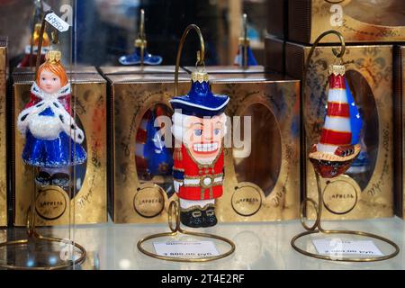 Nizhny Novgorod, Royayaia, May 29, 2023 Nutcracker, ship and Snow Maiden in a store window with handmade Christmas tree decorations. New Year's design Stock Photo