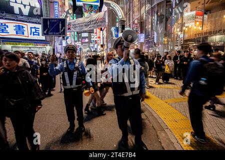 Tokyo, Japan. 29th Oct, 2023. Police control crowds in Center Gai to limit Halloween celebrations. Sunday, October 29th, 2023. In an effort to avoid disruption to locals and ensure safety the mayor of Shibuya ward, Ken Hasebe, urged people to refrain from visiting Shibuya for Halloween reinforcing this message with alcohol bans; a large police presence, and giant billboards saying there would be no festivities this year. Credit: SOPA Images Limited/Alamy Live News Stock Photo