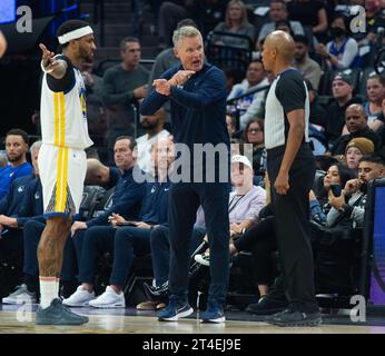 Golden State Warriors guard Gary Payton II (0) shoots next to Denver ...