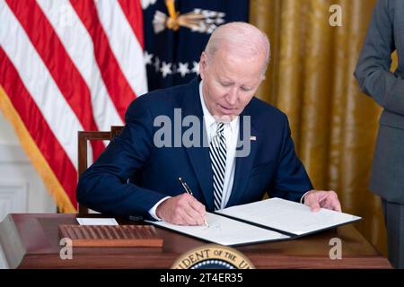 Washington, United States. 30th Oct, 2023. President Joe Biden signs an Executive Order on his administration's approach to artificial intelligence during an event in the East Room at the White House in Washington, DC on Monday, October 30, 2023. Photo by Bonnie Cash/UPI Credit: UPI/Alamy Live News Stock Photo