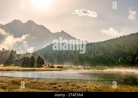 Atmospheric summer Morning at Lej da Staz (Lake Staz), Engadine, Grisons, Switzerland Stock Photo