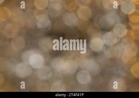 Brown bokeh lights background, unfocused blank full frame image with room for text. Stock Photo