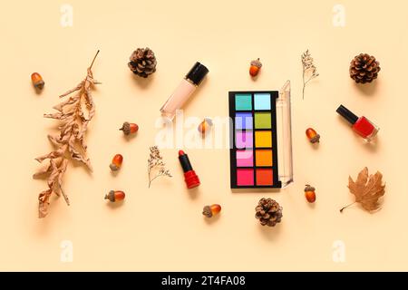 Autumn composition with different makeup products on beige background Stock Photo