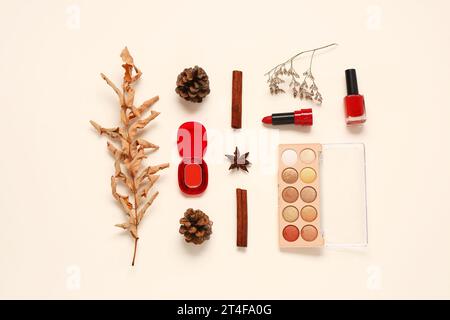 Autumn composition with different makeup products on light background Stock Photo