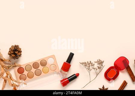 Autumn composition with different makeup products on light background Stock Photo
