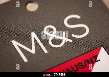 A close-up of the M&S logo as seen on a tag. Stock Photo