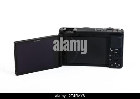 HUETTENBERG, HESSE, GERMANY 06-02-2023: SONY ZV VLOG CAMERA ZV 1. Opened display of the Sony ZV-1 isolated on white background Stock Photo