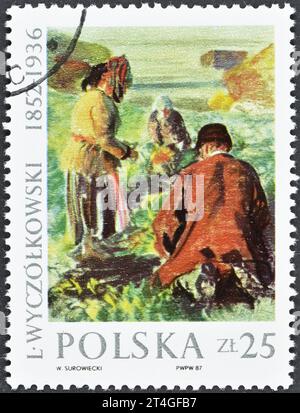 Cancelled postage stamp printed by Poland, that shows painting Harvesting Beetroot, 1911, by Leon Wyczolkowski (1852-1936), circa 1987. Stock Photo