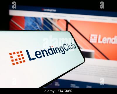 Mobile phone with logo of American financial services company LendingClub Corporation in front of website. Focus on center-left of phone display. Stock Photo