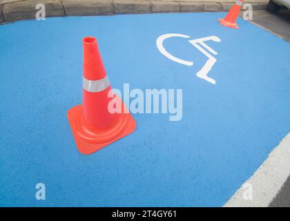 Reserved parking for vehicles of people with disabilities. Just painted floor signal Stock Photo
