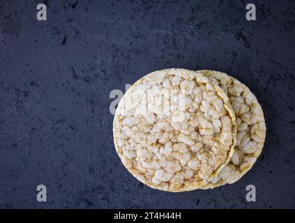 Rice cakes on grey background with text space Stock Photo