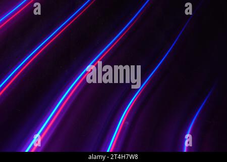 colored light trails on black background, representing the speed of connections in the technology Stock Photo
