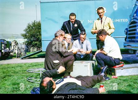 Crew relaxing playing cards, ATV television ITV company outside broadcast, UK  1964 sailing event 1966 Stock Photo