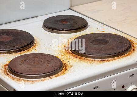 Dirty white electric stove with fat on surface Stock Photo