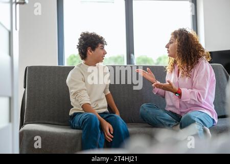 Mother and son arguing with each other at home Stock Photo
