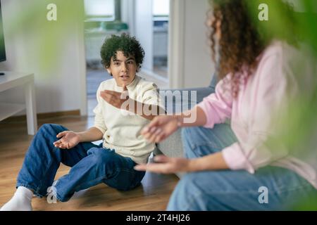 Mother and son arguing with each other at home Stock Photo