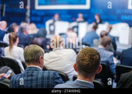 Back view of businessmen attending conference at export forum Stock Photo