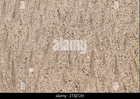 Pattern in the sand left by waves Stock Photo