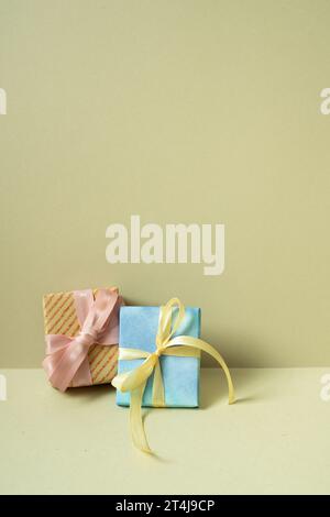 Two gift boxes on table. khaki beige background Stock Photo