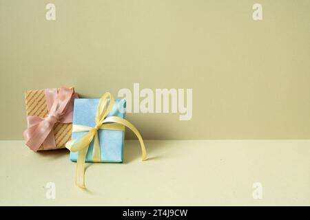 Two gift boxes on table. khaki beige background Stock Photo