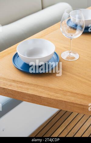 Dining table set for lunch on a luxury yacht deck Stock Photo