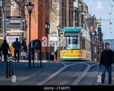 Tram on main street Drottningatan in the city center of Norrkoping, Sweden. The yellow trams are iconic for Norrkoping. Stock Photo