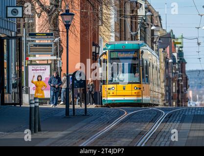 Tram on main street Drottningatan in the city center of Norrkoping, Sweden. The yellow trams are iconic for Norrkoping. Stock Photo