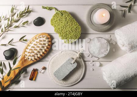 composition with group of bath items on white wooden table. spa and wellness centre. top view Stock Photo