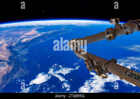 Canadaarm in Space. Digital enhancement of an image by NASA. Stock Photo