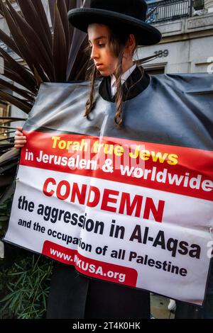 Young boy from the anti-Zionist Haredi Jewish group Neturei Karta join the pro Palestinian protests in London. Stock Photo