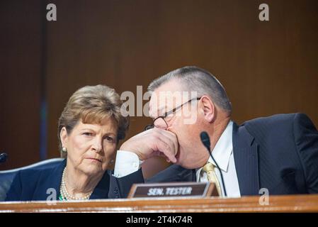 United States Senator Jeanne Shaheen Democrat of New Hampshire and United States Senator Jon Tester Democrat of Montana talk at a Senate Appropriations Hearing to examine the national security supplemental request in the Dirksen Senate Office Building in Washington, DC on Tuesday, October 31, 2023. Copyright: xAnnabellexGordonx/xCNPx/MediaPunchx Credit: Imago/Alamy Live News Stock Photo