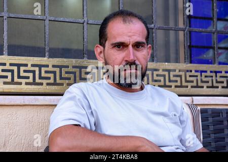 portrait for middle age male wearing white t-shirts Stock Photo