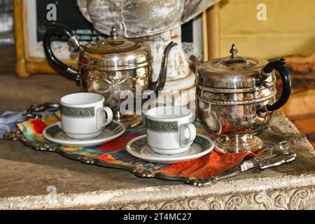 retro silverware tea set, Victorian era, served outdoors on the veranda Stock Photo