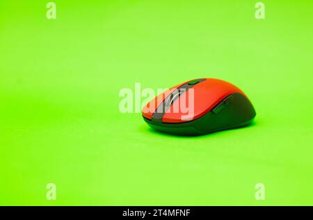 wireless computer mouse isolated on green background Stock Photo