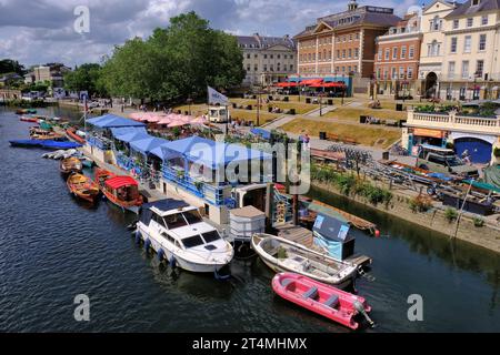 Richmond upon Thames: Colourful boats and buildings of Richmond riverside from Richmond Bridge, south-west London, England, UK Stock Photo