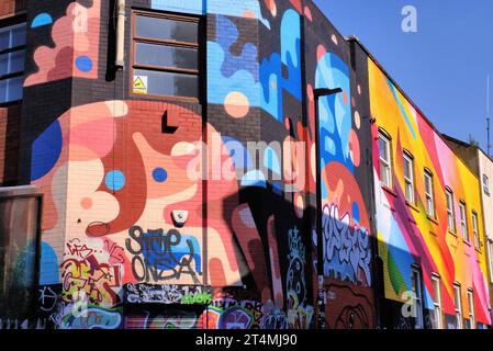 Shoreditch: Colourful street art and graffiti on building in Chance Street, Shoreditch, London, England, UK Stock Photo