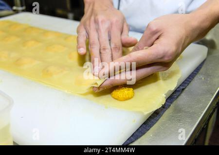 Chef preparing ravioli in a Italian restaurant kitchen Stock Photo