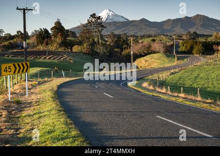 Rural backroad running through farm pasture land, Taranaki, New Zealand Stock Photo