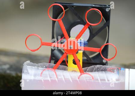 Automatic soap bubble blowing machine made with 3D printed parts built at home close up view Stock Photo