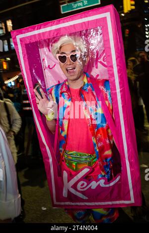 New York City, NY, USA. 31st Oct, 2023. The annual Greenwich Village Halloween Parade drew crowds of costumed participants along with bands, dance troupes, stilt walkers, commercial floats, and giant puppets. A man as a boxed Ken doll. Credit: Ed Lefkowicz/Alamy Live News Stock Photo