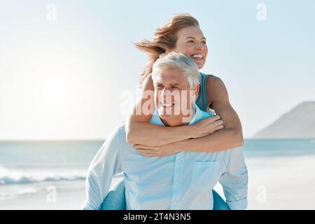 Just enjoying our free time. a mature couple spending time together at the beach. Stock Photo