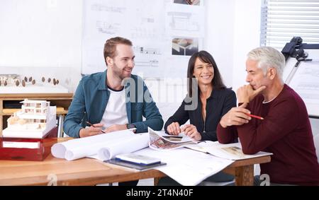 The architectural dream team. three architects working on a new building design. Stock Photo