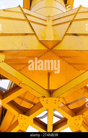 Yellow titan crane low-angle shot, in Parc des Chantiers former shipyards of Nantes, France Stock Photo