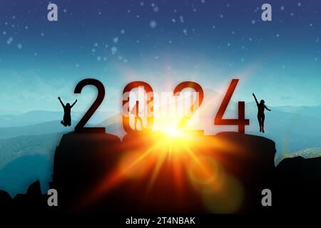 Silhouette two tourist hikers climbing up mountain and jumping on the top of mountain with 2024 numbers. Happy new year and holiday celebration Stock Photo