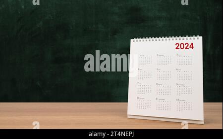 Calendar year 2024 schedule on wood table blackboard background. copy space. Stock Photo