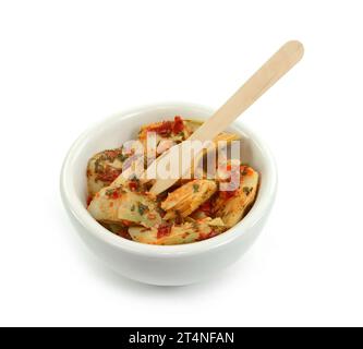 artichokes salad with vegetable mix sauce dressing in a bowl isolated on white background. Stock Photo